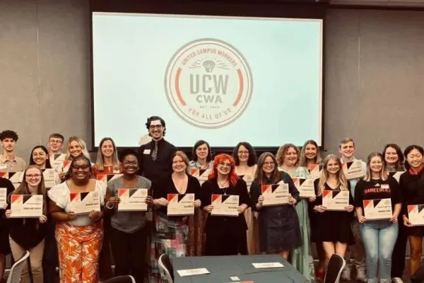 Students pose with their awards presented by United Campus Workers